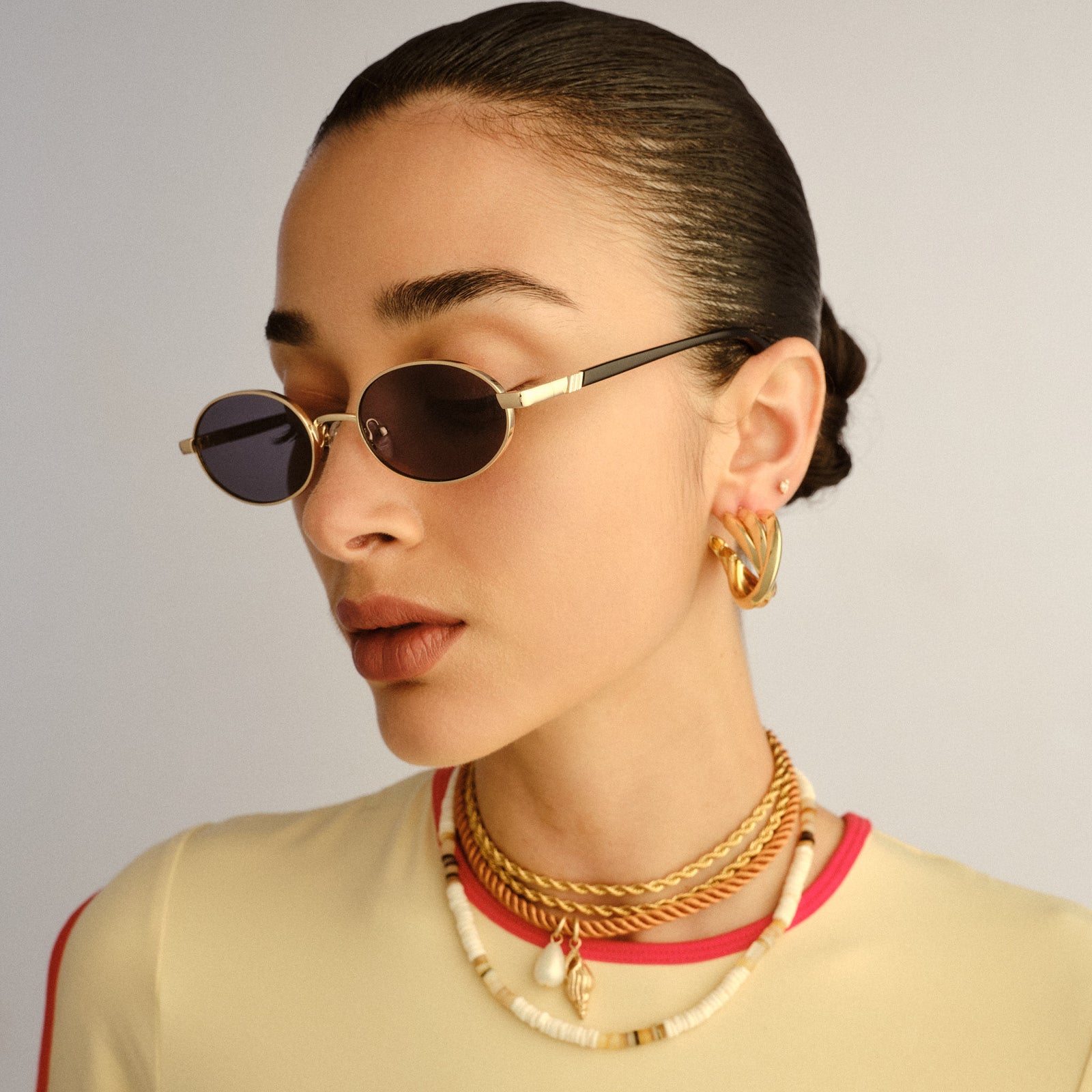 Icicle Bright Gold Uni-Sex Oval Sunglasses | Le Specs