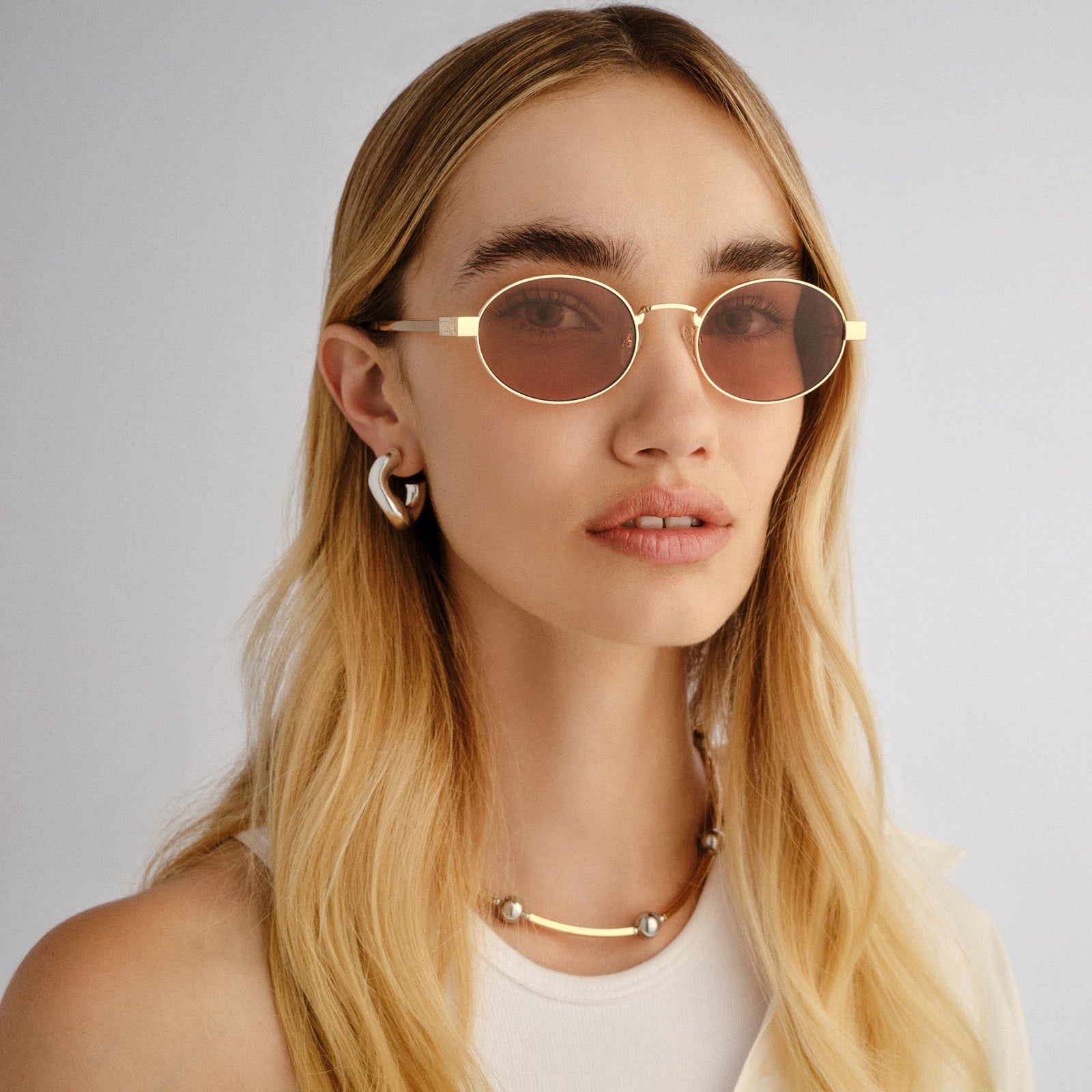Poseidon Deux Gold Female Oval Sunglasses | Le Specs