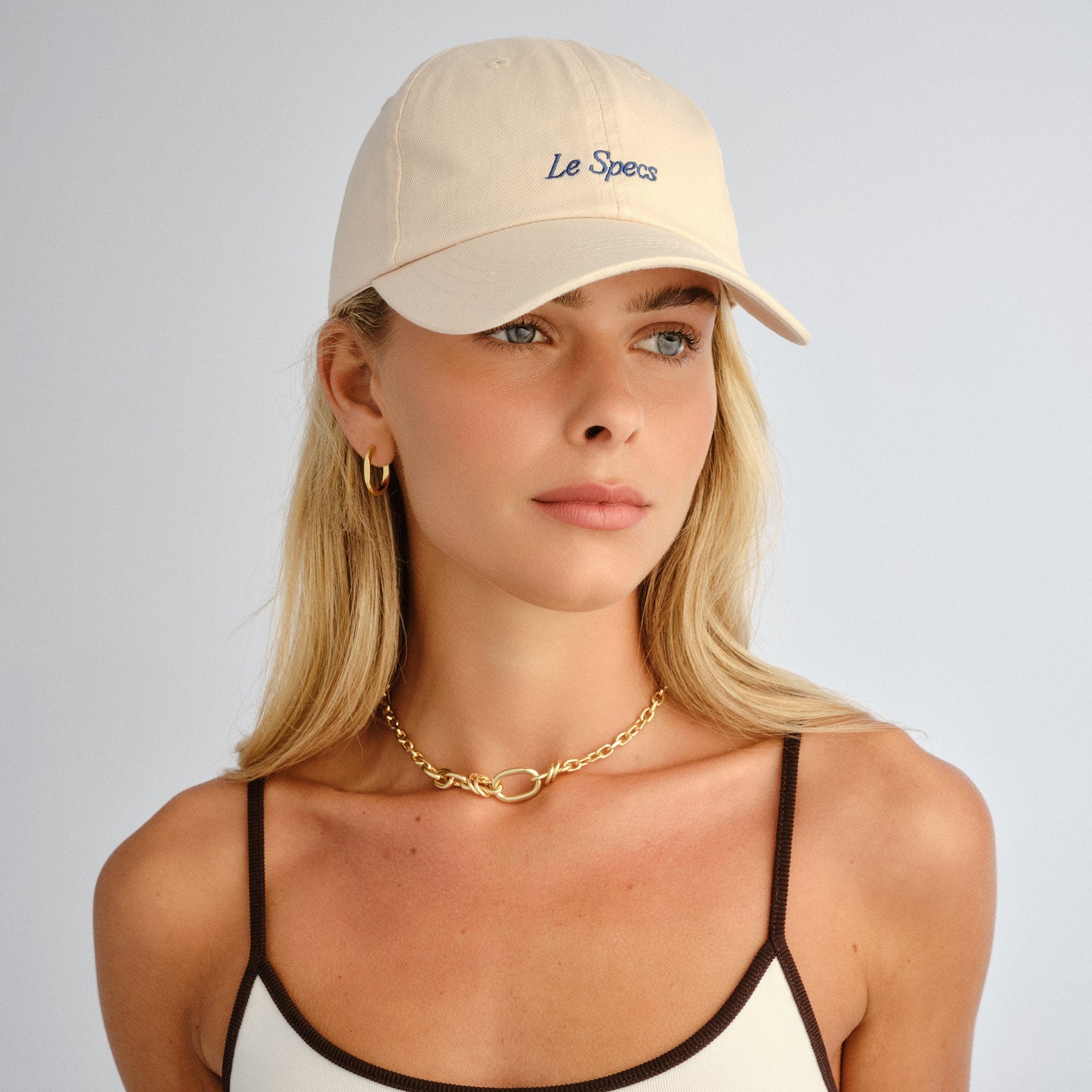 Less26mar2 Cream Uni-Sex Accessories Marketing | Le Specs